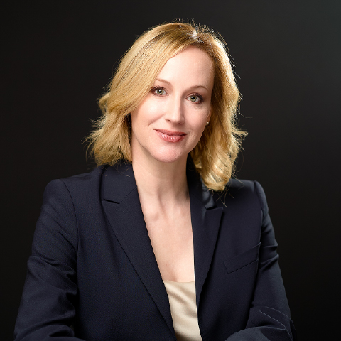 Portrait of Jeanette Schneider, CDFA - CEO & Founding Partner